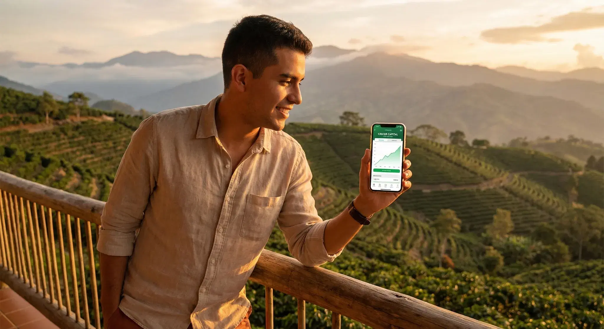 Inversionista joven mirando paisaje cafetero con app LOKL